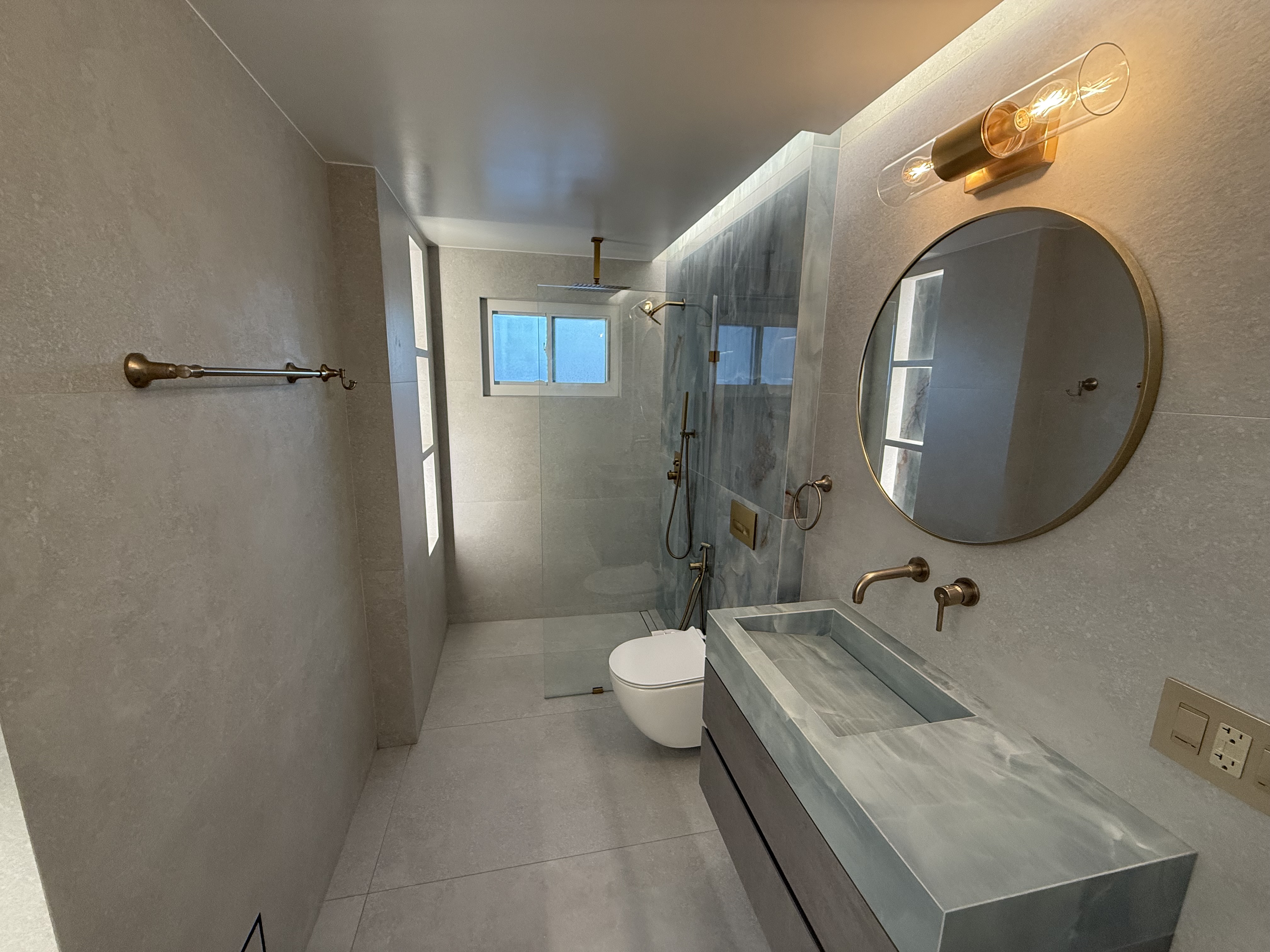 Finished bathroom remodel by All American Tiles